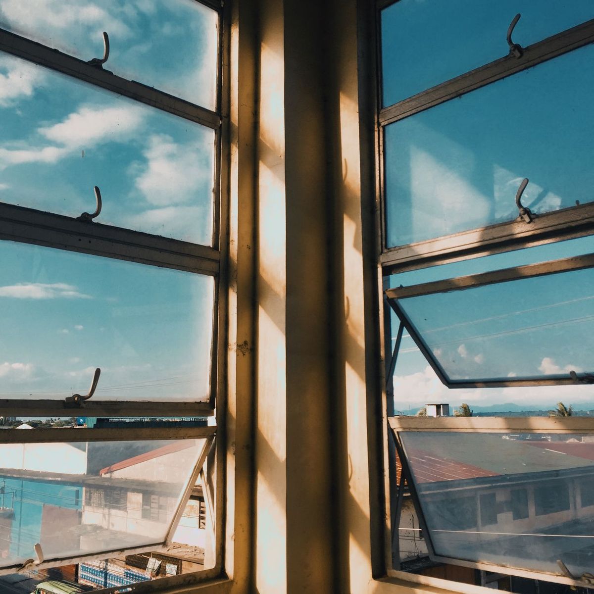 Close view of an aluminum window frame and glass opening